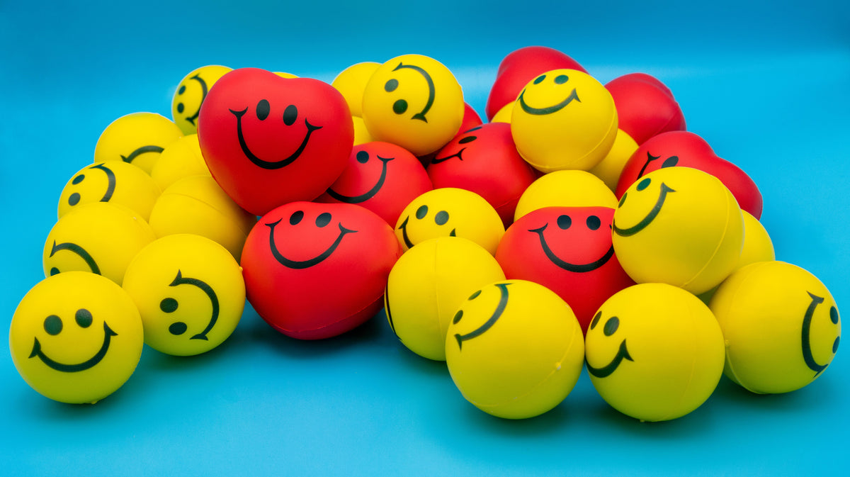 Set de pelotas squishy sonrientes de colores